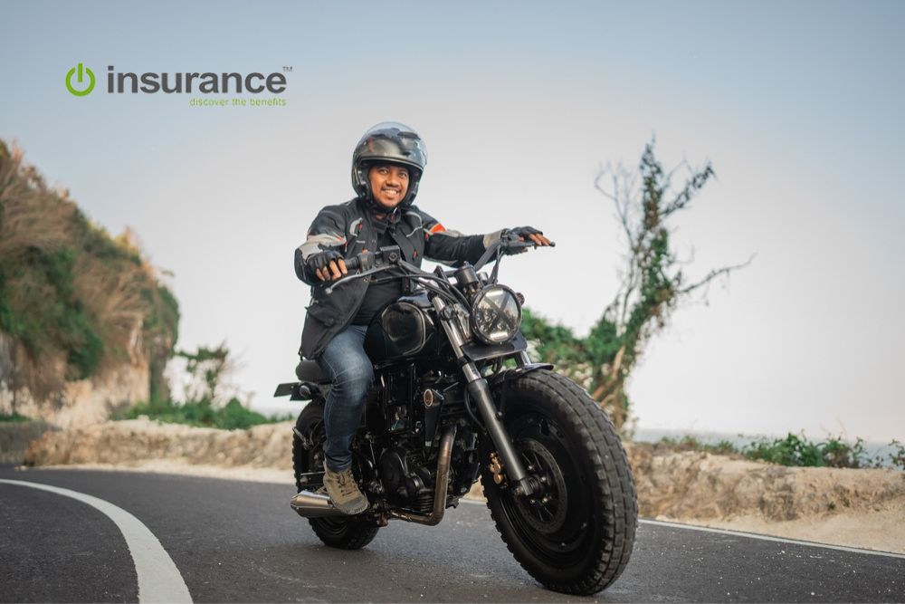 A man driving a motorcycle