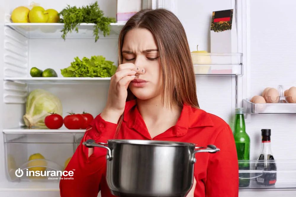 women reacting over food spoilage in home